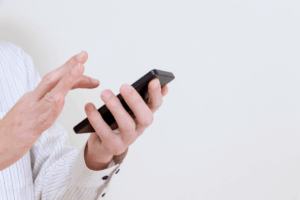 Woman using her phone to search for a dentist and doctor